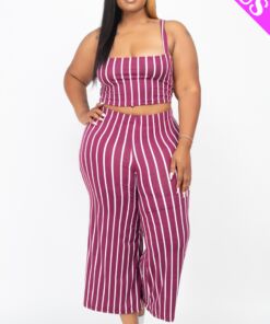 Woman wearing a purple and white striped two-piece outfit.