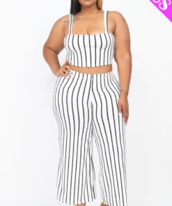 Plus-size woman modeling a stylish striped two-piece outfit.