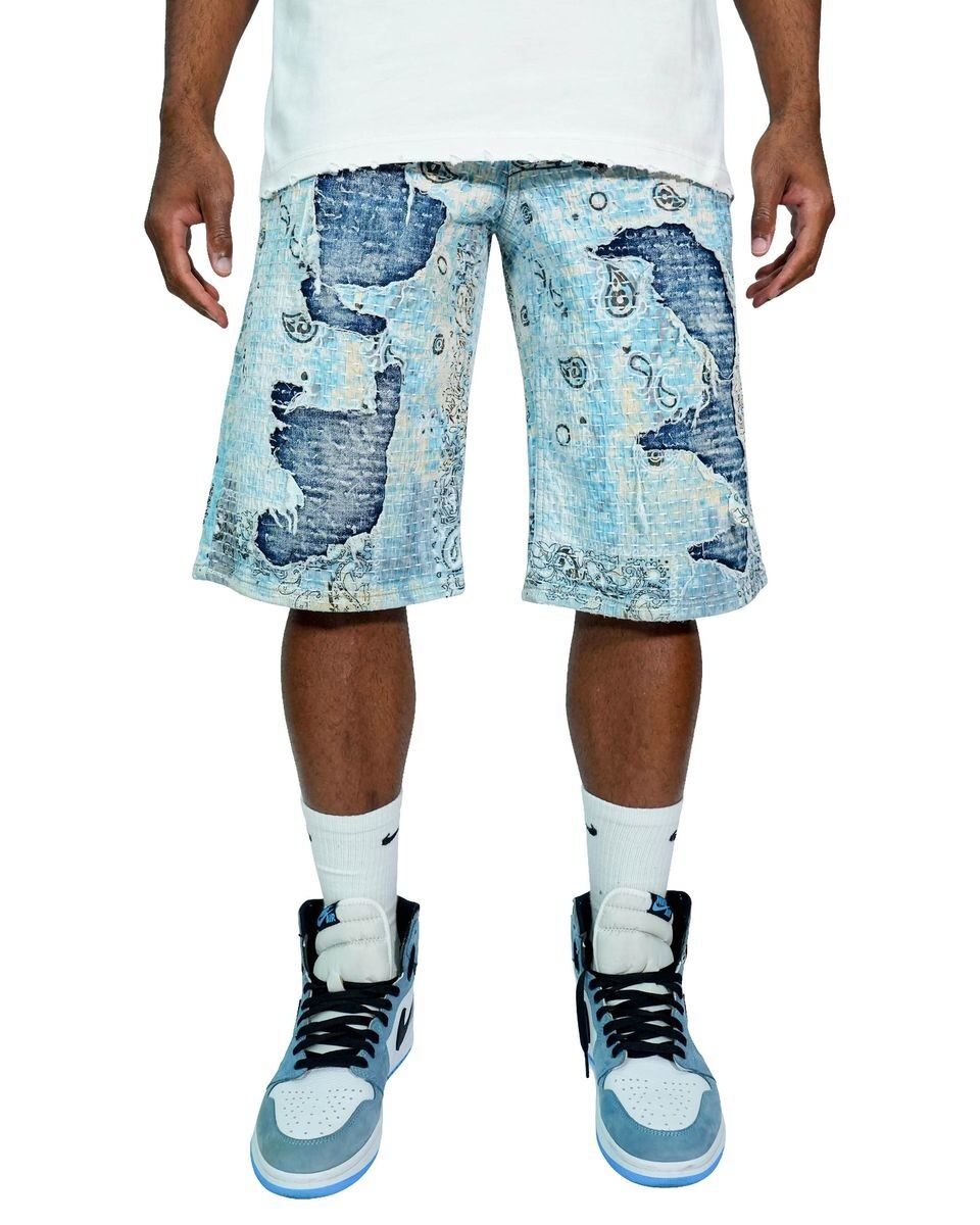 Man wearing distressed denim shorts with sneakers and white socks.