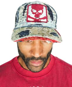 Man wearing a colorful cap with a red skull design and a red shirt.
