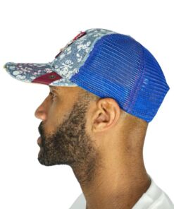 Man wearing a floral patterned cap with a blue mesh back.