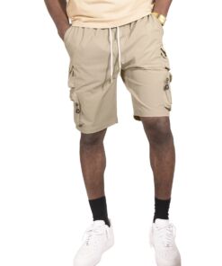 Man wearing beige cargo shorts with pockets and white sneakers.