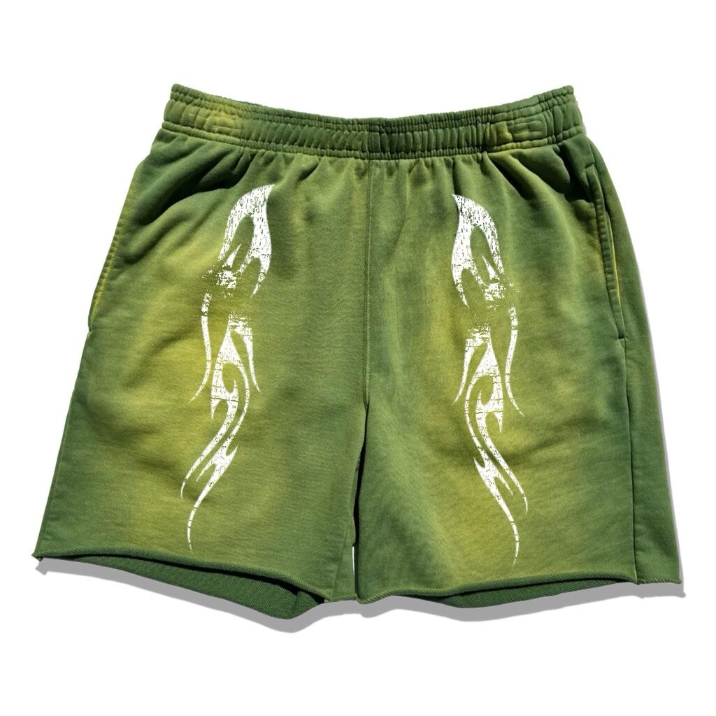 Green shorts with white tribal designs on the front.