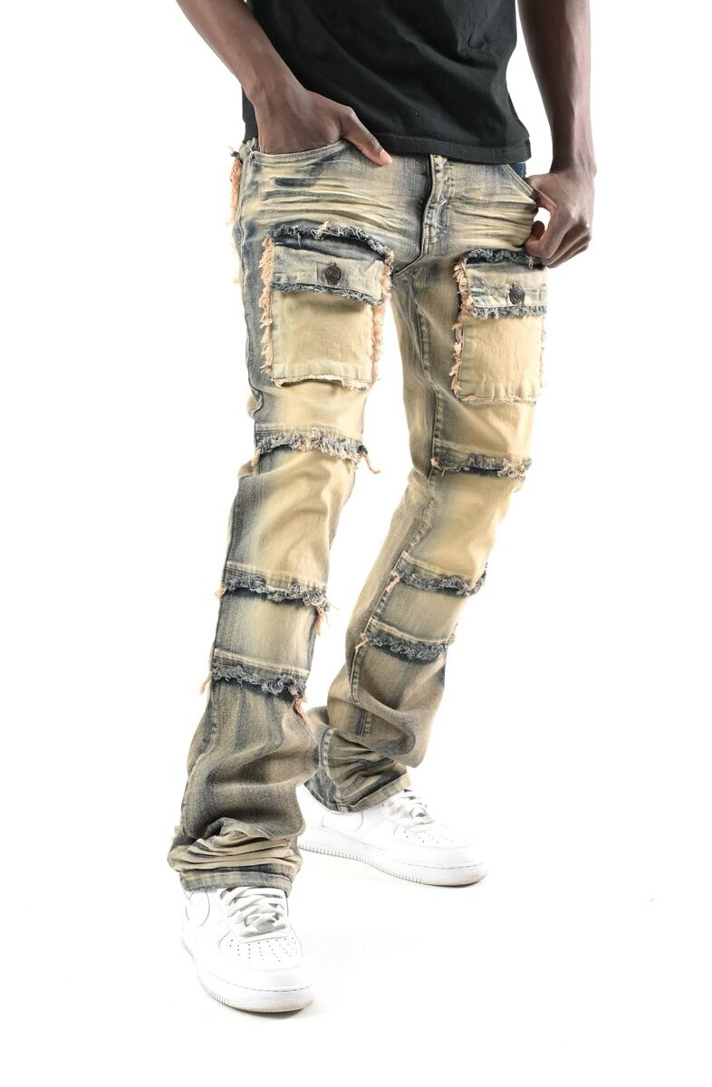 Distressed beige cargo jeans with frayed details and patch pockets.