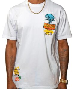 White t-shirt with colorful graphic prints and rolled sleeves.